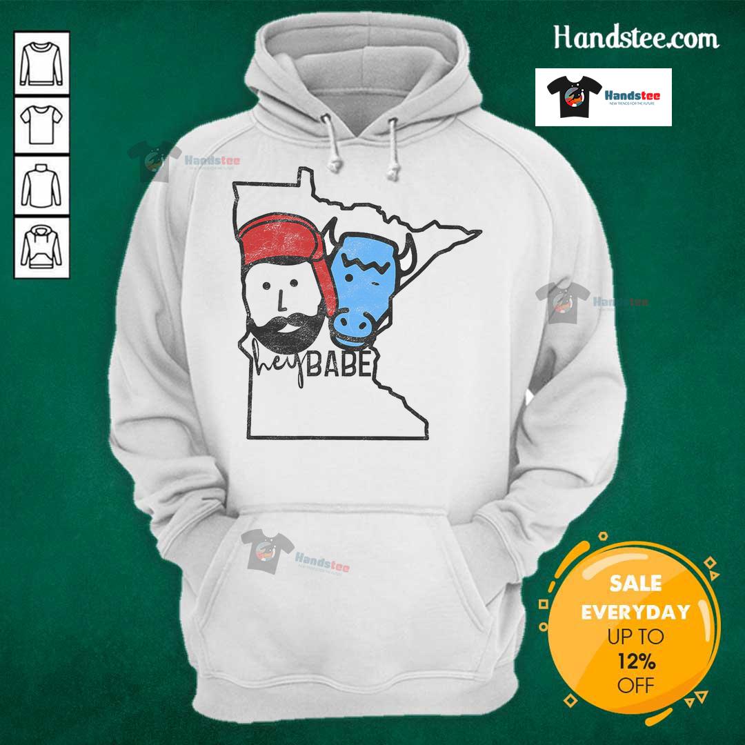 Cute Minnesota babe wearing a Paul Bunyan hoodie, showcasing local style and charm in a cozy outdoor setting.