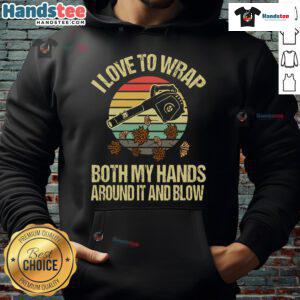 Funny vintage sunset hoodie featuring a person joyfully using a leaf blower with both hands wrapped around it.