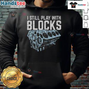 Funny mechanic in a playful hoodie, working on a car engine with colorful blocks, showcasing the 'Funny-Mechanic-I-Still-Play-With-Blocks' theme.