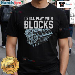 Funny mechanic I still play with blocks car engine T-shirt design featuring playful graphics and bold text.