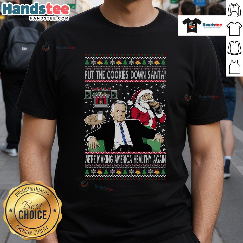 Funny Christmas T-Shirt featuring Santa with 'Put The Cookies Down, We're Making America Healthy Again' slogan.