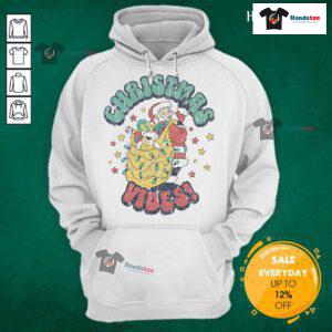Vintage Santa Claus cartoon design on a cozy Christmas hoodie, perfect for festive holiday wear.