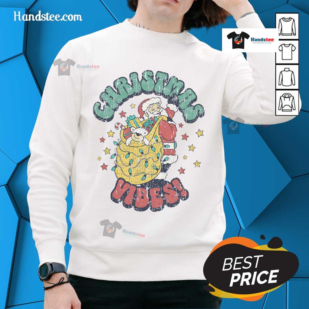 Vintage Santa Claus cartoon design on a cozy Christmas sweatshirt, perfect for festive holiday celebrations.