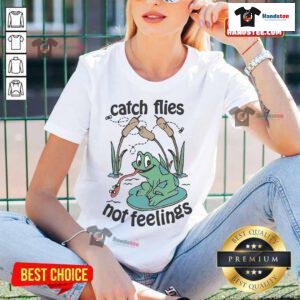 Official Catch Flies Not Feelings Frogs Ladies Tee featuring a playful frog graphic and stylish text design.
