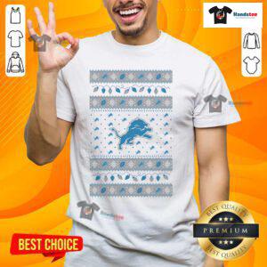 Alt Text: Official Detroit Lions Holiday Christmas T-Shirt featuring festive design and team logo, perfect for fans this season.
