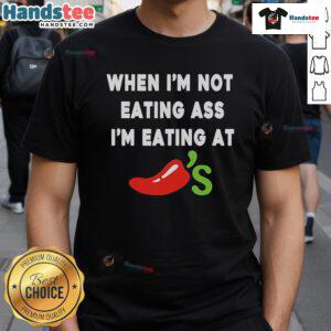 Alt Text: Official When I'M Not Eating Ass I'M Eating At Chili'S T-Shirt featuring bold text and playful design for food enthusiasts.