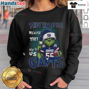 Premium Grinch sweatshirt featuring 'They Hate Us Because They Ain't Us' for New York Giants fans, perfect for cold weather.