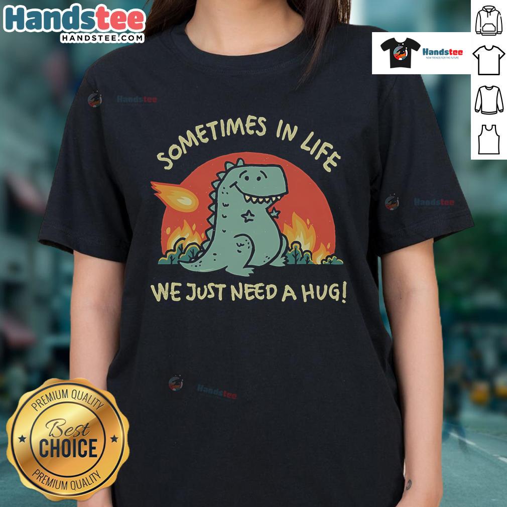 Alt Text: Cute dinosaur graphic on a ladies tee with the phrase Sometimes in life we just need a hug for comfort and style.