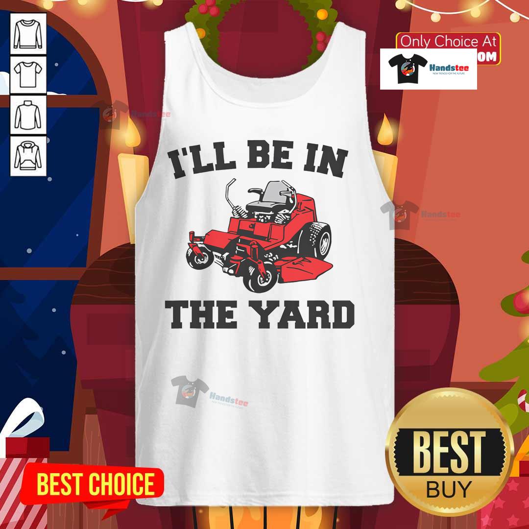 Man in tank top laughing while mowing yard, showcasing funny landscaping moments with a mower.