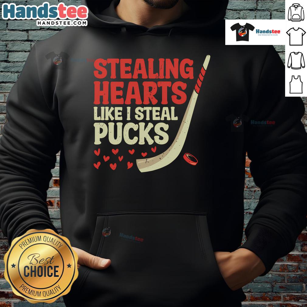 Alt Text: Cute hockey player hoodie design featuring Funny Stealing Hearts Like I Steal Pucks text for hockey fans.