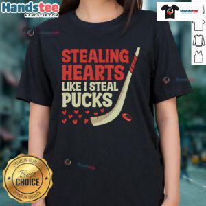 Funny stealing hearts like I steal pucks design on a cute hockey player ladies tee shirt for hockey lovers.