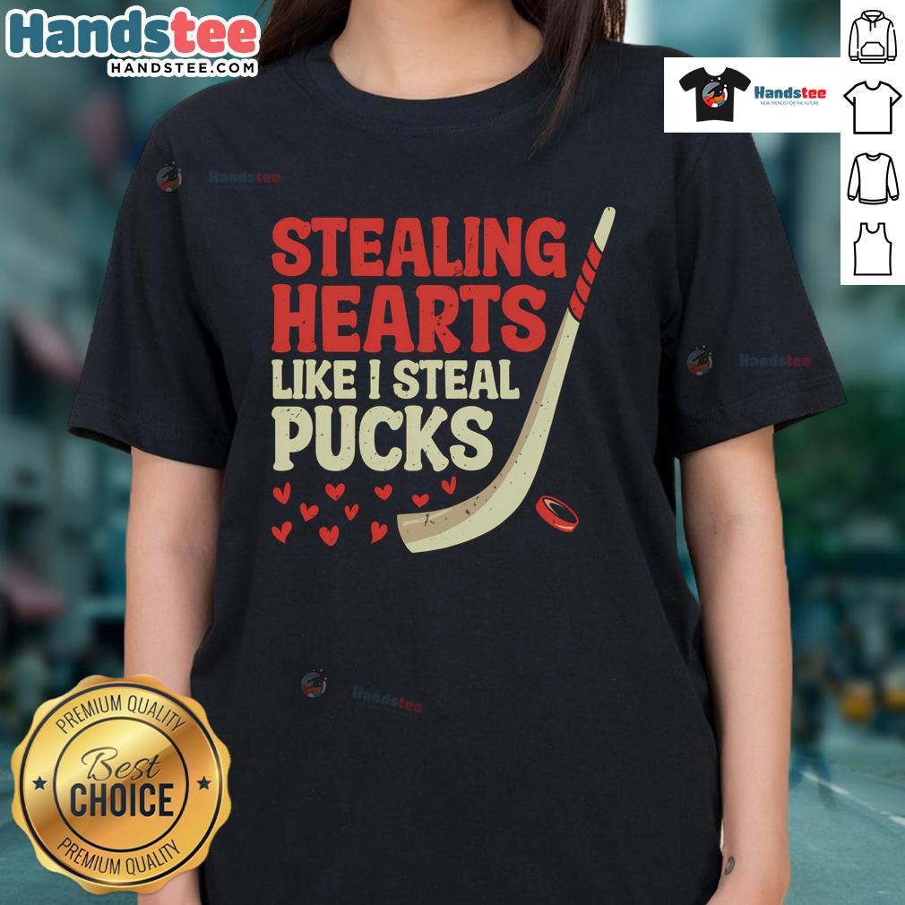 Funny stealing hearts like I steal pucks design on a cute hockey player ladies tee shirt for hockey lovers.