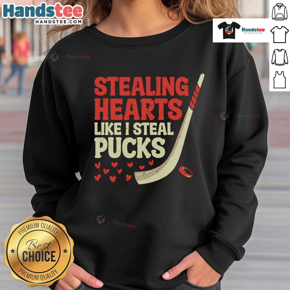 Funny stealing hearts like I steal pucks sweatshirt design featuring a cute hockey player graphic, perfect for fans.