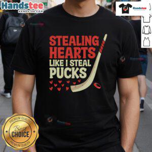 Alt Text: Cute hockey player design t-shirt with Stealing Hearts Like I Steal Pucks slogan, perfect for hockey fans.