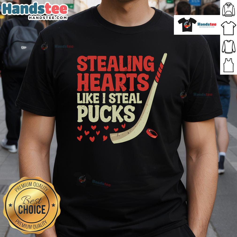 Alt Text: Cute hockey player design t-shirt with Stealing Hearts Like I Steal Pucks slogan, perfect for hockey fans.