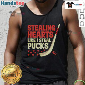 Cute hockey player tank top design featuring the phrase Stealing Hearts Like I Steal Pucks in a playful font.