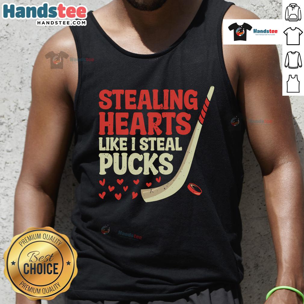 Cute hockey player tank top design featuring the phrase Stealing Hearts Like I Steal Pucks in a playful font.