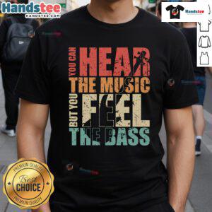 Alt Text: Vintage T-shirt featuring the phrase You Can Hear The Music But You Feel The Bass in a funky design.