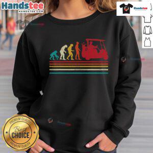 Funny golfer wearing a vintage sweatshirt with 'Good Human Evolution' design on a golf cart, perfect for golf enthusiasts.