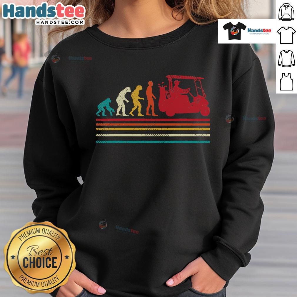 Funny golfer wearing a vintage sweatshirt with 'Good Human Evolution' design on a golf cart, perfect for golf enthusiasts.