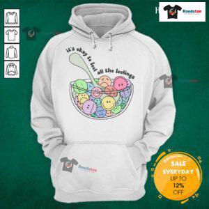 Good It's Okay To Feel All The Feelings Hoodie displayed on a hanger, featuring a cozy design and uplifting message.