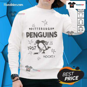 Vintage Pittsburgh Penguins logo from 1967 on a cozy hockey sweatshirt, perfect for fans of the NHL team.