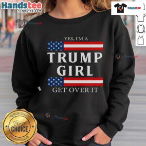 Girl wearing a patriotic sweatshirt featuring the USA flag, promoting pride in America and voting for Trump.