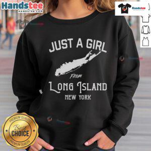 Happy girl wearing a 'Just A Girl From Long Island, New York' sweatshirt, smiling in a sunny outdoor setting.