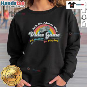 Cozy sweatshirt with 'Ask Me About The Video Game I'd Rather Be Playing' print, perfect for gamers and casual wear.