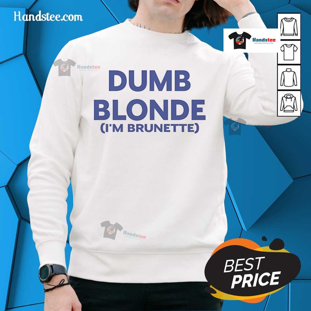 Brunette woman wearing a 'Nice Dumb Blonde' sweatshirt, showcasing a trendy casual outfit with a playful message.