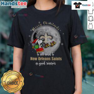 Santa Snoopy wishing Merry Christmas to all, featuring New Orleans Saints theme on a ladies tee.