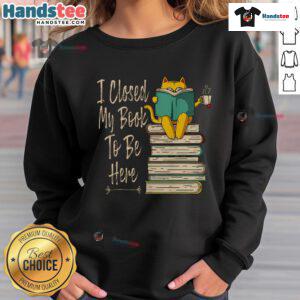 Cozy sweatshirt featuring a humorous cat and coffee design with the phrase 'Funny I Closed My Book To Be Here.'