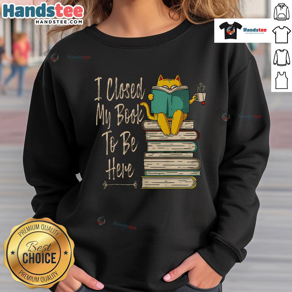 Cozy sweatshirt featuring a humorous cat and coffee design with the phrase 'Funny I Closed My Book To Be Here.'