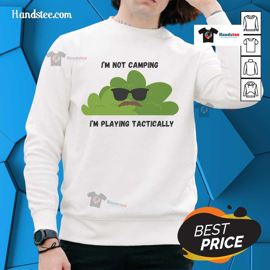 Funny 'I'm Not Camping, I'm Playing Tactically' sweatshirt design, perfect for outdoor enthusiasts and humor lovers.