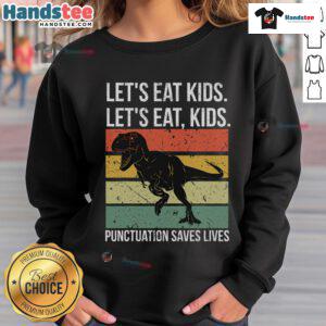 Funny 'Let's Eat Kids' sweatshirt featuring a T-Rex, highlighting the importance of punctuation for grammar.