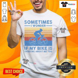 Alt Text: Vintage T-shirt with 'Sometimes I Wonder If My Bike Is Thinking About Me Too' print, perfect for bike lovers.