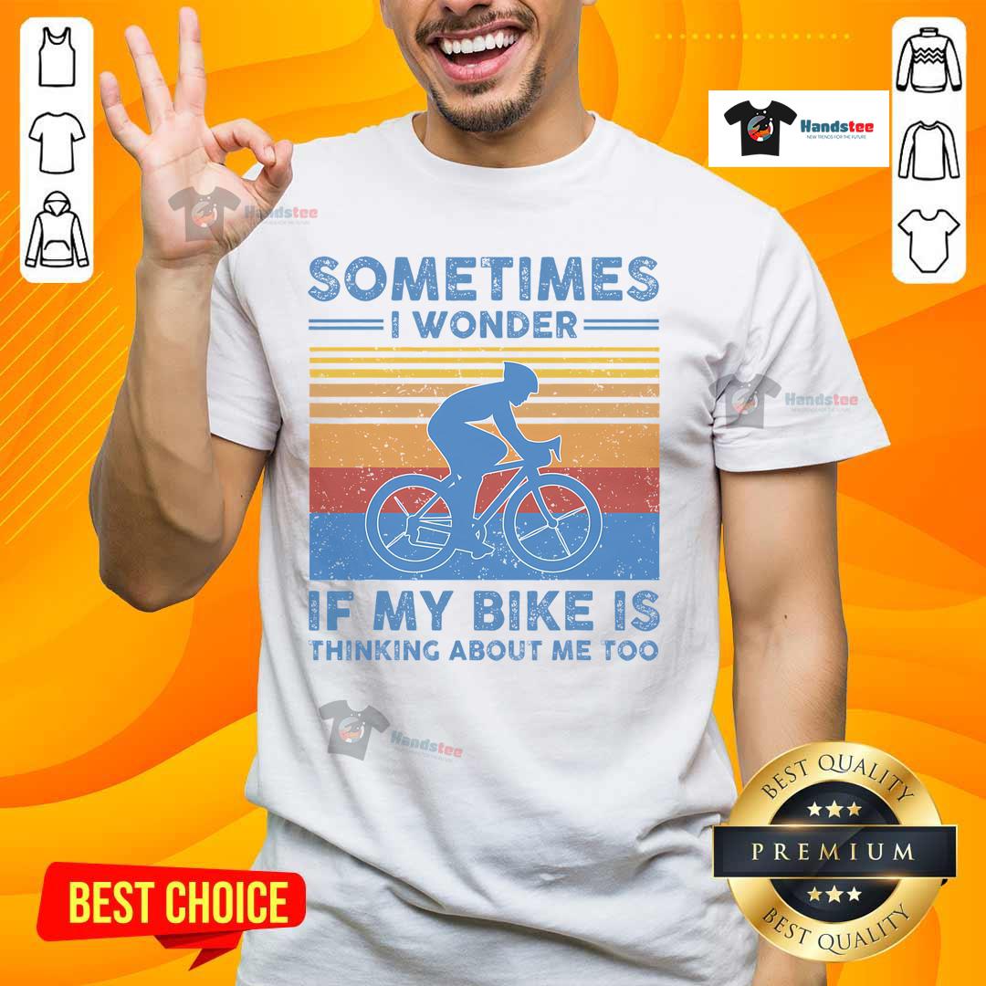 Alt Text: Vintage T-shirt with 'Sometimes I Wonder If My Bike Is Thinking About Me Too' print, perfect for bike lovers.