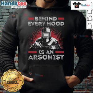 Funny welder wearing 'Behind Every Hood is an Arsonist' hoodie while welding, showcasing humor and craftsmanship.