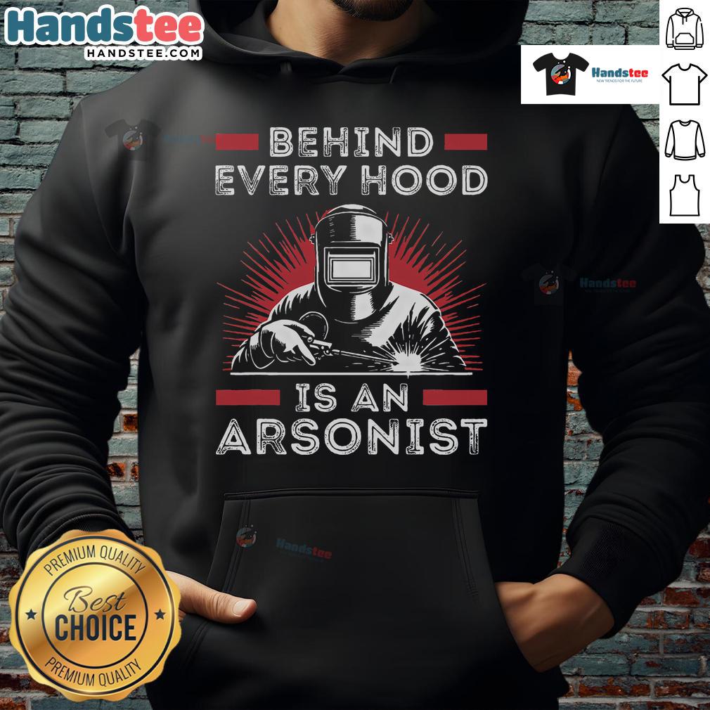 Funny welder wearing 'Behind Every Hood is an Arsonist' hoodie while welding, showcasing humor and craftsmanship.