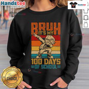 Child wearing a '100 Days of School' sweatshirt, dabbing in celebration of the 100th day of school milestone.