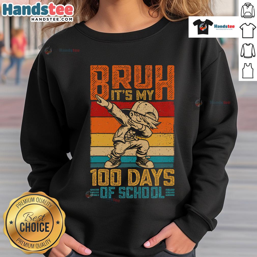 Child wearing a '100 Days of School' sweatshirt, dabbing in celebration of the 100th day of school milestone.