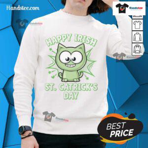 Happy Irish cat wearing a St. Patrick's Day sweatshirt, celebrating with festive colors and playful charm.