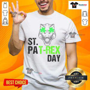Happy St Patrex Day Dino St Patrick's Day T-Shirt featuring a cheerful dinosaur in festive green attire.