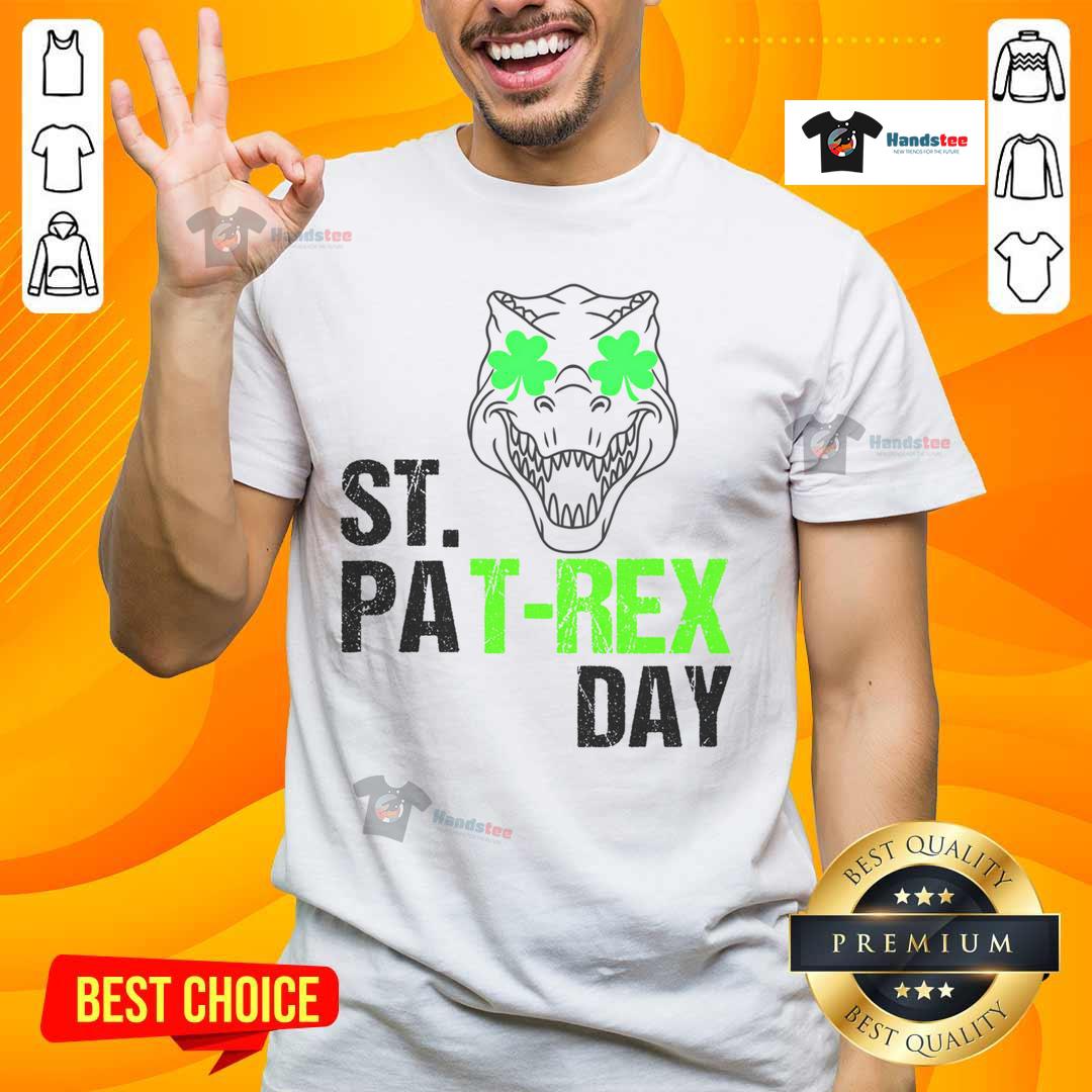 Happy St Patrex Day Dino St Patrick's Day T-Shirt featuring a cheerful dinosaur in festive green attire.