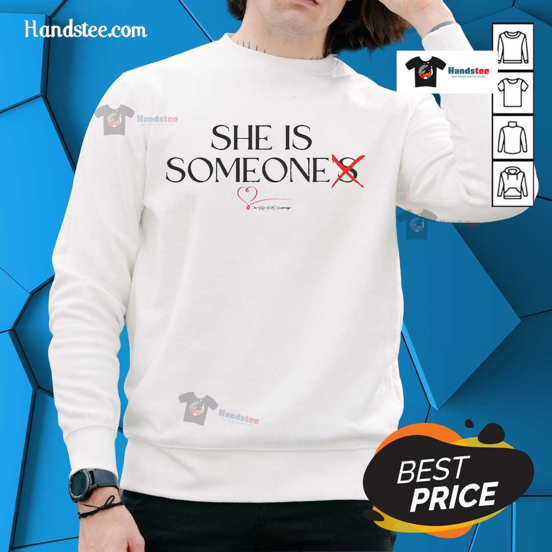 Stylish woman wearing a 'Hot She Is Someone' red heart sweatshirt, showcasing trendy casual fashion for comfort and style.