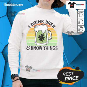Retro sunset sweatshirt featuring 'I drink beer and know things' phrase, perfect for casual outings and beer lovers.