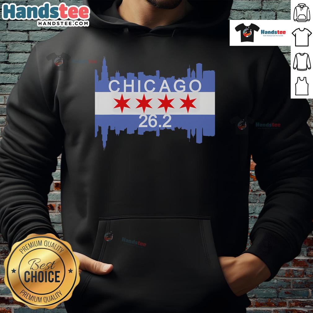 Runner in Chicago flag hoodie crossing finish line at 26.2-mile marathon, showcasing determination and athletic spirit.