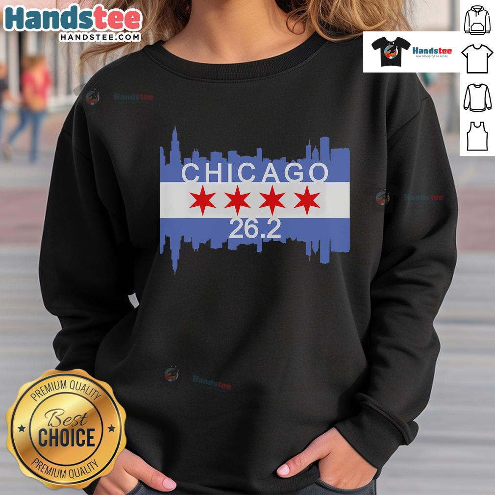 Runner in a Chicago flag sweatshirt completing a 26.2-mile marathon, showcasing athletic spirit and city pride.