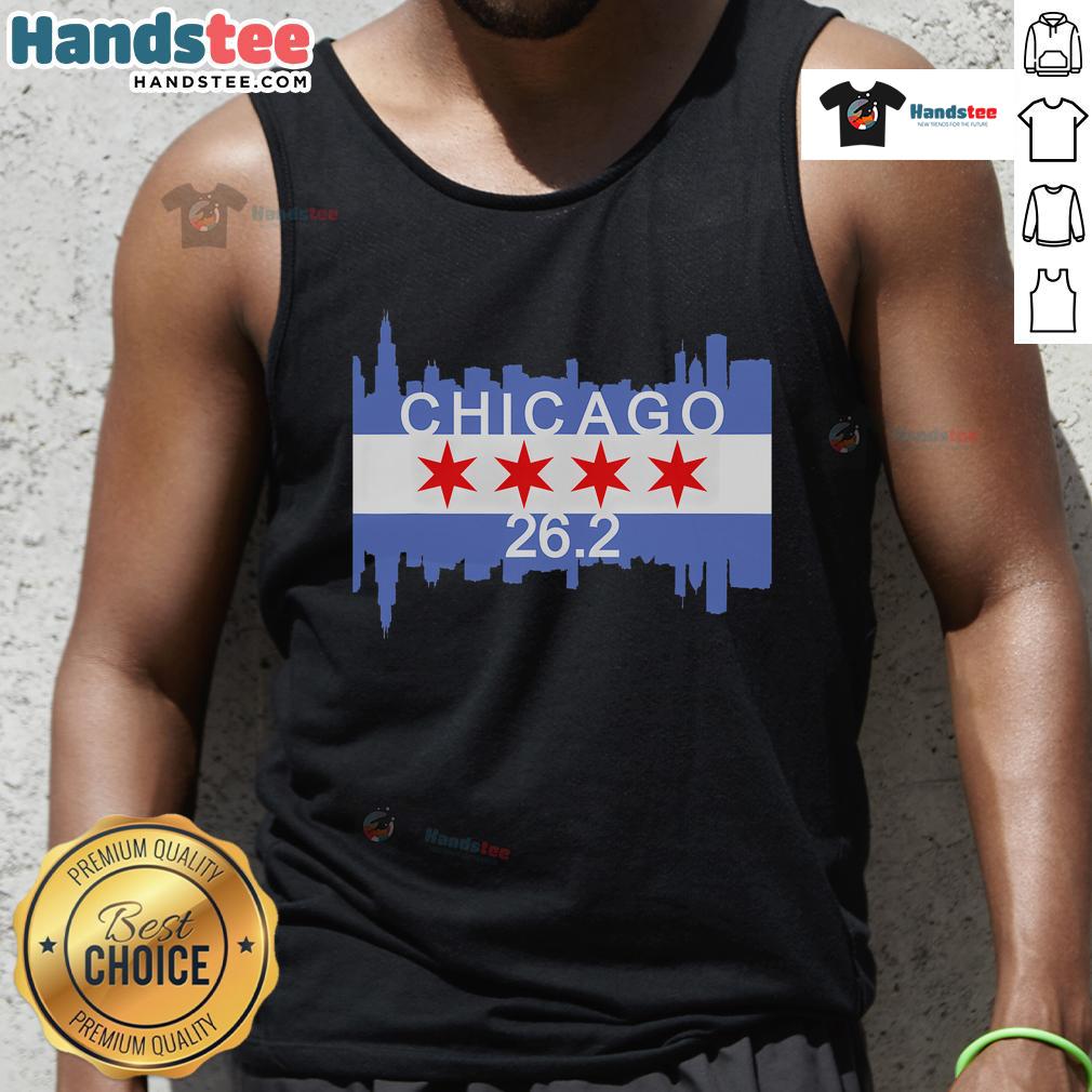 Runner in a Chicago flag tank top crossing the finish line at the 26.2-mile marathon, showcasing athletic spirit.