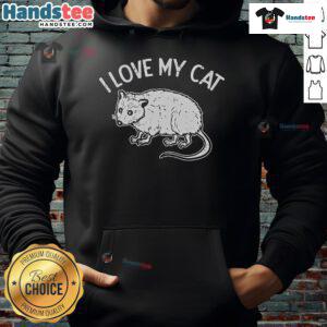 Adorable opossum wearing a 'I Love My Cat' hoodie, showcasing a humorous pet-themed fashion statement.